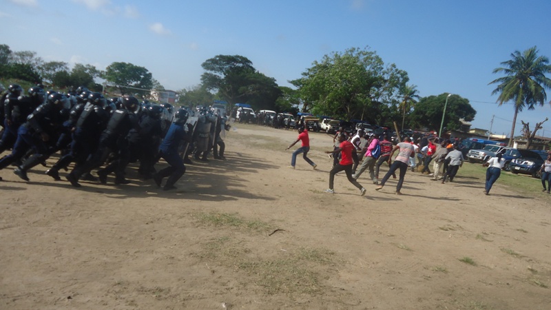 police-in-protective-equipment-closing-down-on-rowdy-crowd-at-a-polling-station-in-the-police-simulation-exercise